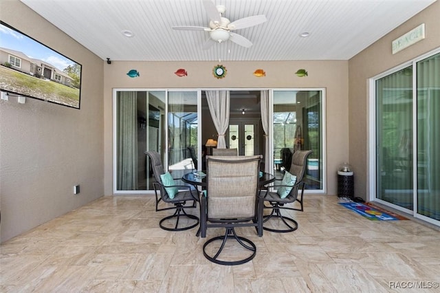 5888 W Corral Pl, Beverly Hills, FL 34465 - view of patio featuring ceiling fan, french doors, and outdoor dining area