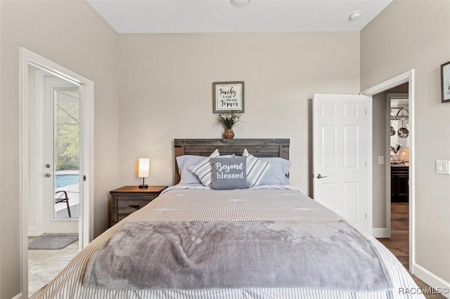 5888 W Corral Pl, Beverly Hills, FL 34465 - bedroom featuring baseboards, access to exterior, and wood finished floors