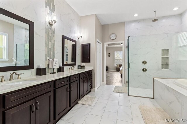 5888 W Corral Pl, Beverly Hills, FL 34465 - bathroom featuring a marble finish shower, marble look tile flooring, a bath, double vanity, and recessed lighting