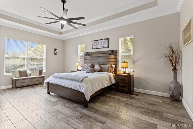 5888 W Corral Pl, Beverly Hills, FL 34465 - bedroom featuring a tray ceiling, ornamental molding, multiple windows, and wood finished floors