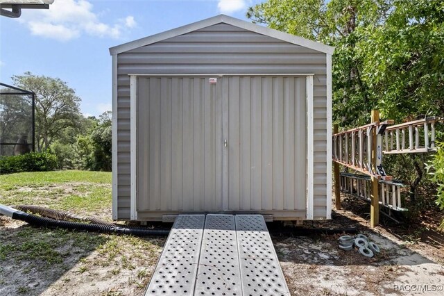 5888 W Corral Pl, Beverly Hills, FL 34465 - view of shed with outdoor dining area