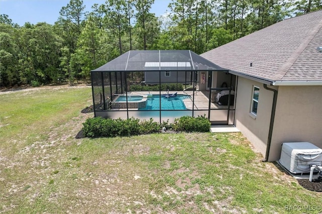 5888 W Corral Pl, Beverly Hills, FL 34465 - view of pool with glass enclosure, a yard, a patio, and a pool with connected hot tub