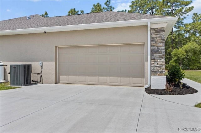 5888 W Corral Pl, Beverly Hills, FL 34465 - garage featuring concrete driveway and central air condition unit