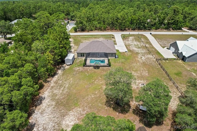 5888 W Corral Pl, Beverly Hills, FL 34465 - aerial view of property and surrounding area with a heavily wooded area and a pool area