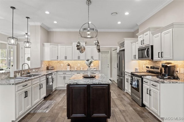 5888 W Corral Pl, Beverly Hills, FL 34465 - kitchen featuring stainless steel appliances, a sink, white cabinetry, decorative backsplash, and ornamental molding