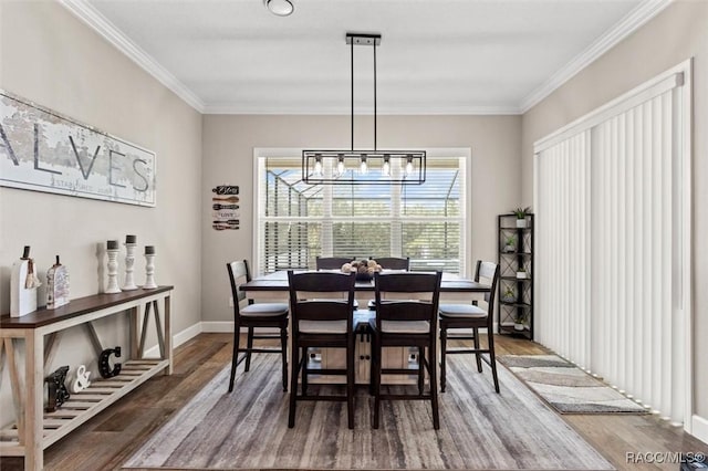 5888 W Corral Pl, Beverly Hills, FL 34465 - dining room featuring wood finished floors, a chandelier, ornamental molding, and baseboards