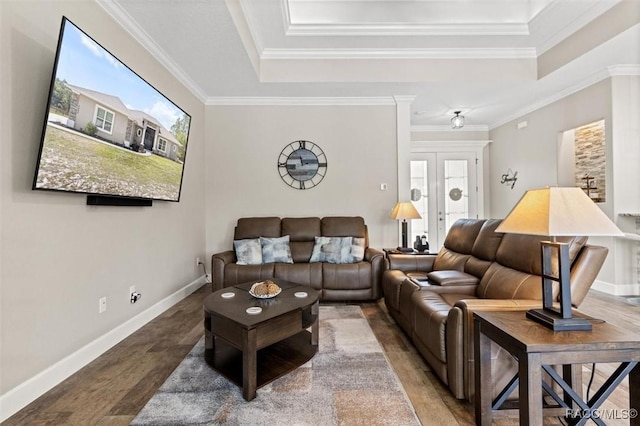 5888 W Corral Pl, Beverly Hills, FL 34465 - living room featuring a tray ceiling, ornamental molding, and baseboards