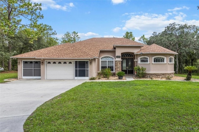 4491 W Stable Ct, Beverly Hills, FL 34465 - view of front of home with stucco siding, a garage, concrete driveway, and a front yard