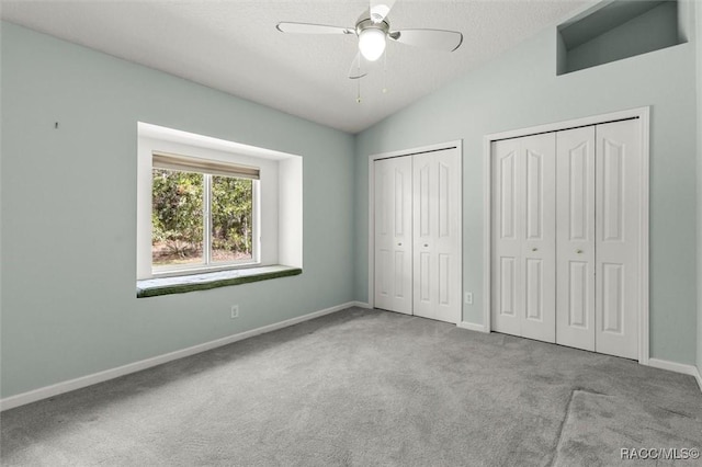 4491 W Stable Ct, Beverly Hills, FL 34465 - unfurnished bedroom featuring carpet flooring, two closets, lofted ceiling, and a ceiling fan