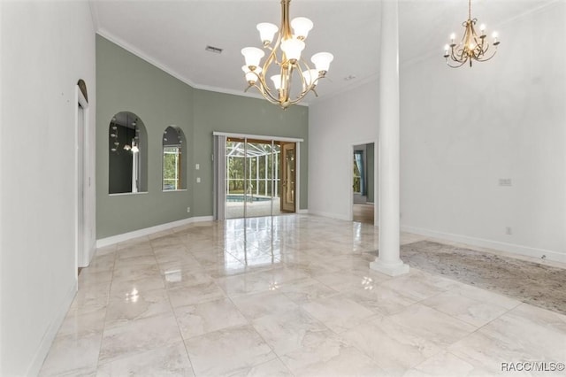 4491 W Stable Ct, Beverly Hills, FL 34465 - unfurnished room with a chandelier, light marble finish floors, crown molding, a towering ceiling, and arched walkways
