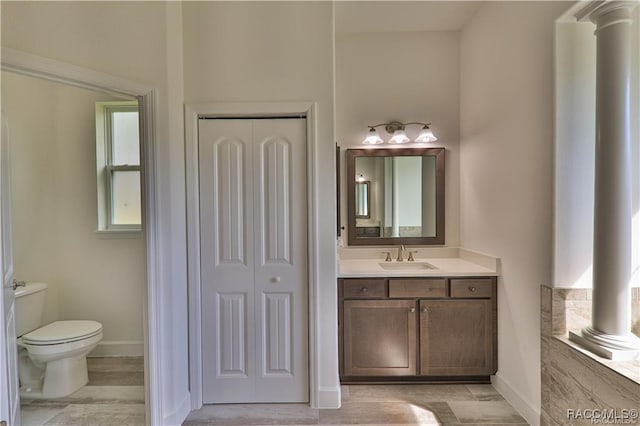 4496 N Elkcam Blvd, Beverly Hills, FL 34465 - bathroom featuring vanity, a closet, wood finished floors, and decorative columns