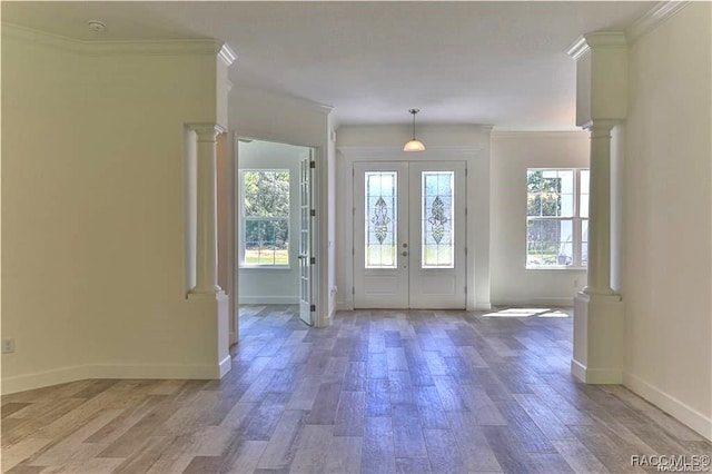 4496 N Elkcam Blvd, Beverly Hills, FL 34465 - entryway featuring wood finished floors, crown molding, french doors, and ornate columns