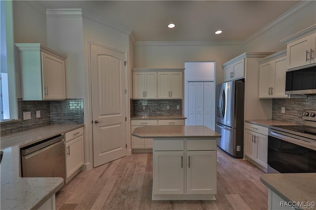 4496 N Elkcam Blvd, Beverly Hills, FL 34465 - kitchen with appliances with stainless steel finishes, backsplash, ornamental molding, light wood-type flooring, and recessed lighting