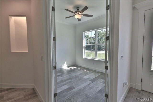 4496 N Elkcam Blvd, Beverly Hills, FL 34465 - empty room with ornamental molding, ceiling fan, and wood finished floors