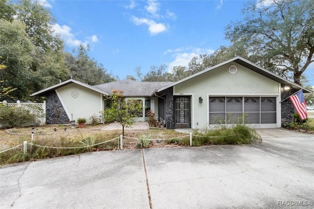 ranch-style home featuring a garage