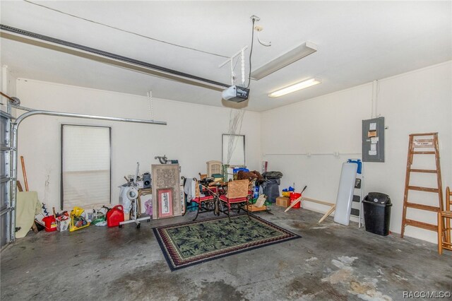 garage featuring electric panel and a garage door opener