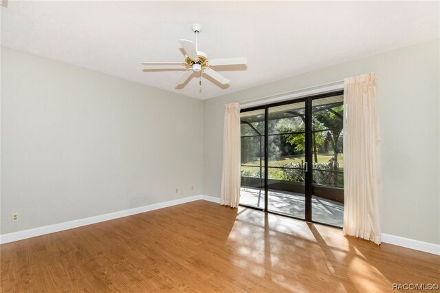 spare room featuring ceiling fan and hardwood / wood-style flooring