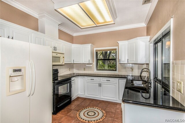 kitchen featuring white cabinets, white appliances, sink, and tasteful backsplash