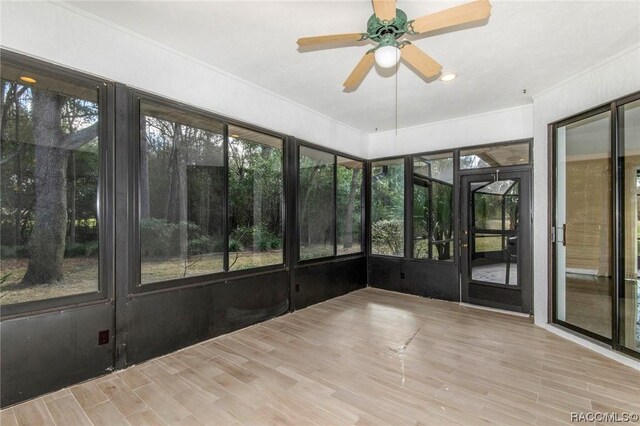 3356 N Bent Tree Pt, Lecanto, FL 34461 - unfurnished sunroom featuring ceiling fan, plenty of natural light, and french doors