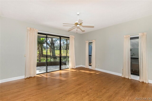 empty room featuring ceiling fan and wood-type flooring