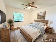 21389 SW 102cd St, Dunnellon, FL 34431 - bedroom featuring wood finished floors and ceiling fan