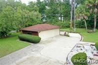 21389 SW 102cd St, Dunnellon, FL 34431 - view of community with a lawn