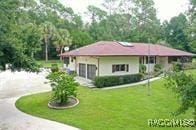 21389 SW 102cd St, Dunnellon, FL 34431 - view of front of property featuring a front yard and driveway