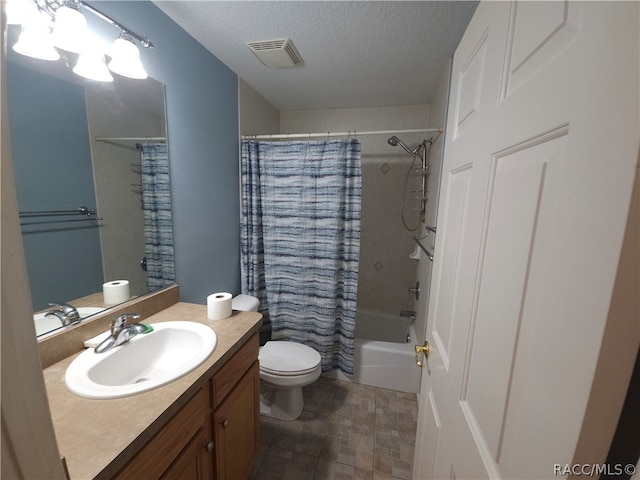 full bathroom featuring shower / tub combo, vanity, a textured ceiling, and toilet