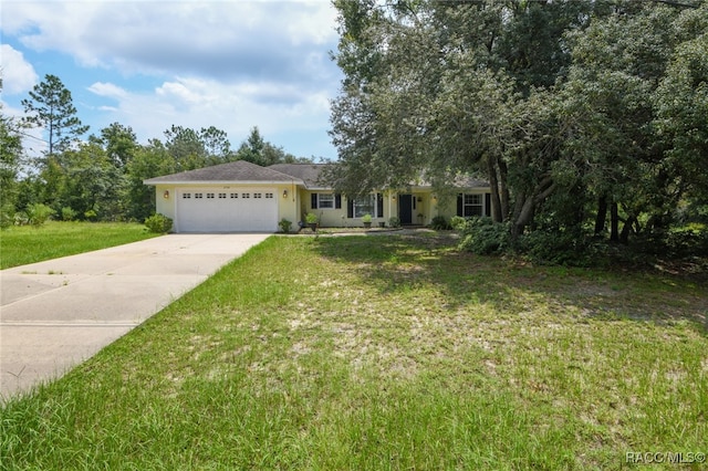 view of front facade featuring a front yard and a garage