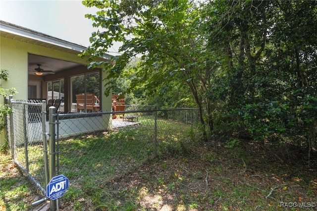 view of yard featuring ceiling fan