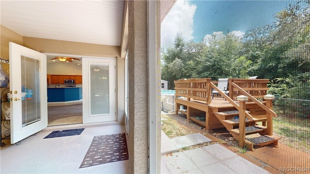 exterior space with concrete flooring and french doors