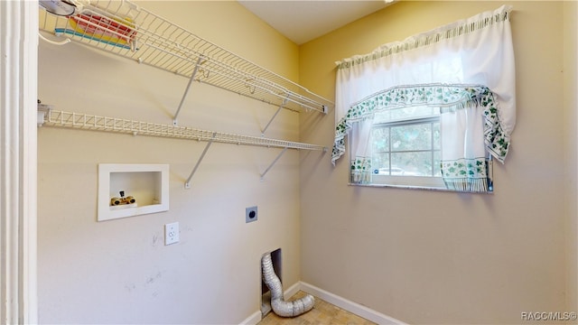 clothes washing area featuring hookup for a washing machine and electric dryer hookup