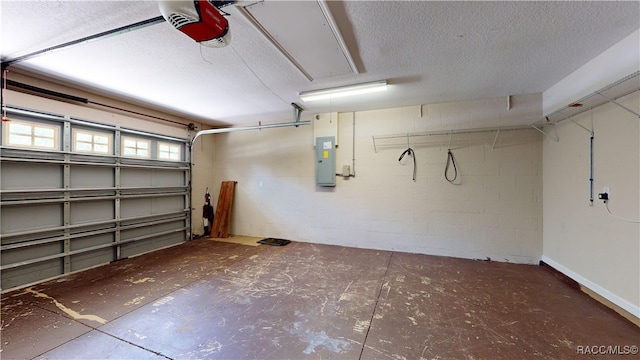 garage with electric panel and a garage door opener