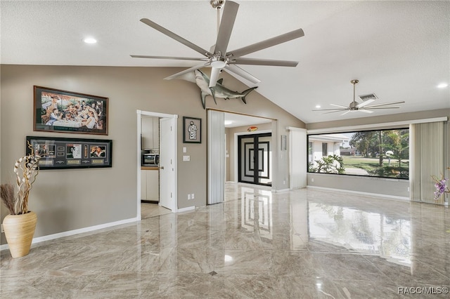 empty room featuring ceiling fan, marble finish floor, baseboards, and lofted ceiling