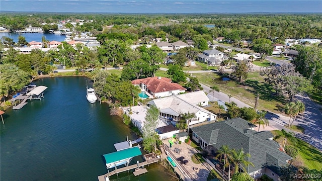 drone / aerial view featuring a water view and a residential view