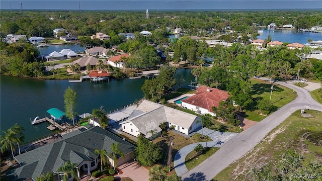 drone / aerial view with a water view and a residential view