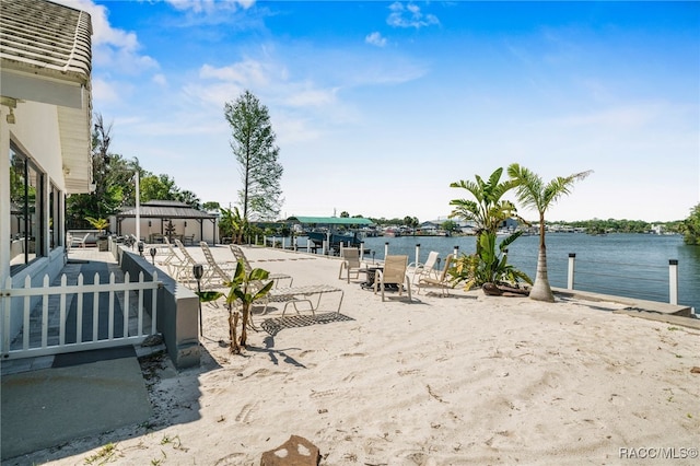 exterior space featuring a water view and a gazebo