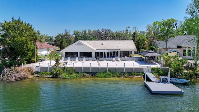 dock area with a water view and a gazebo