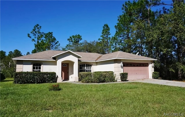 ranch-style home featuring a front yard and a garage