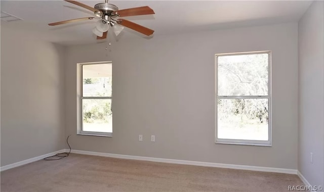 carpeted empty room with ceiling fan