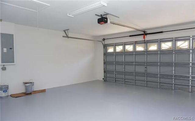 garage with electric panel and a garage door opener