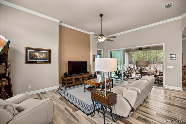 living room with crown molding, ceiling fan, and light hardwood / wood-style flooring