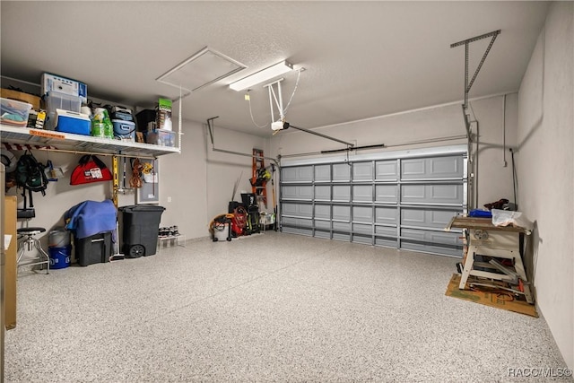 garage featuring a garage door opener