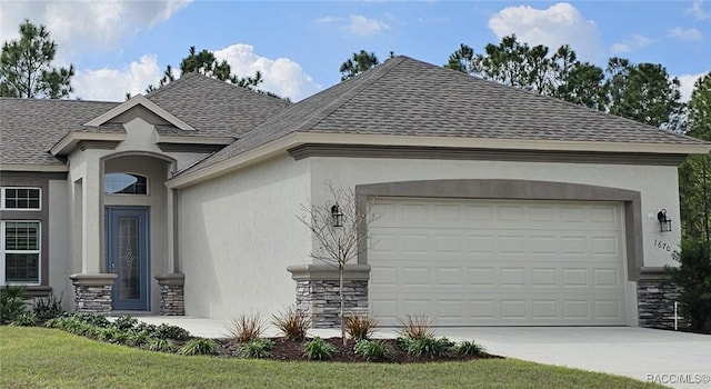 view of front of home with a garage and a front lawn