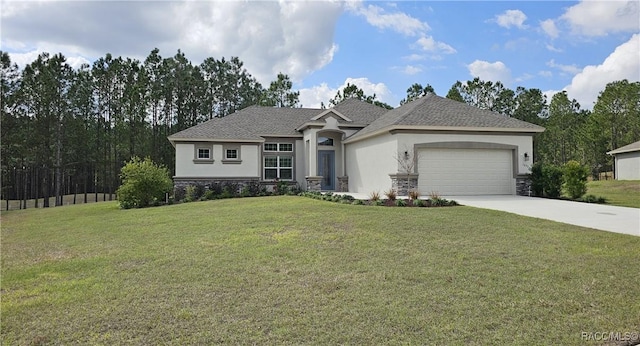 view of front of house featuring a garage and a front lawn