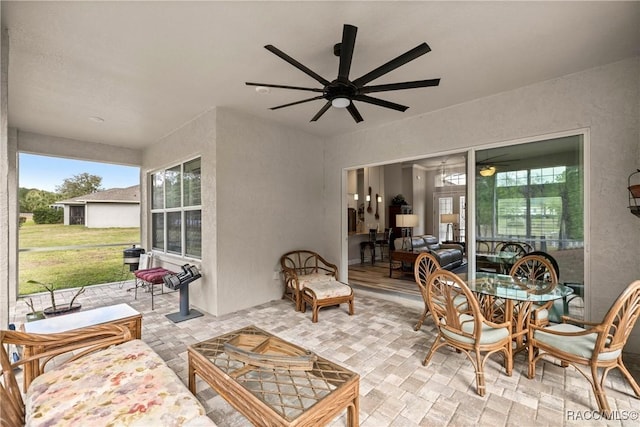 view of patio with outdoor lounge area and ceiling fan