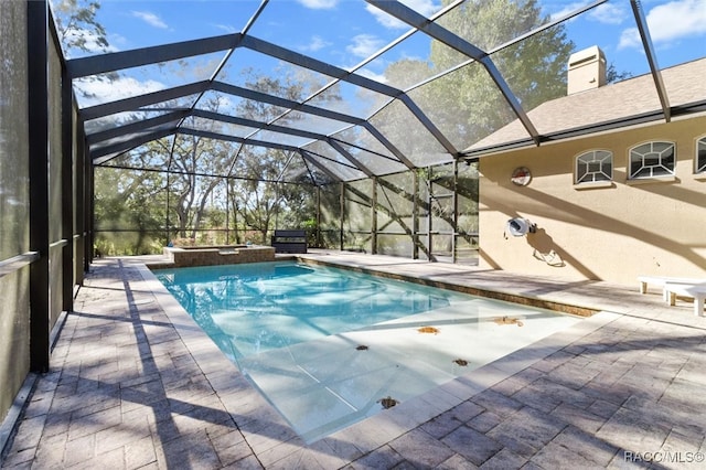 view of pool featuring a patio area and a lanai