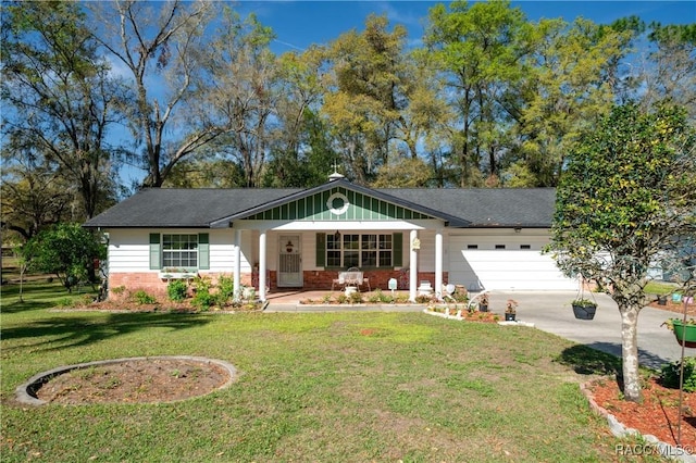 ranch-style home featuring a front yard, brick siding, a garage, and driveway