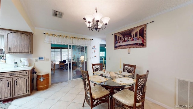 dining space featuring light tile patterned floors, visible vents, crown molding, and an inviting chandelier