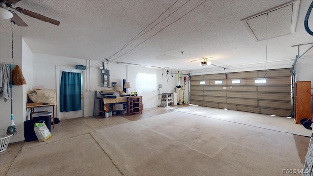 garage featuring a garage door opener and ceiling fan